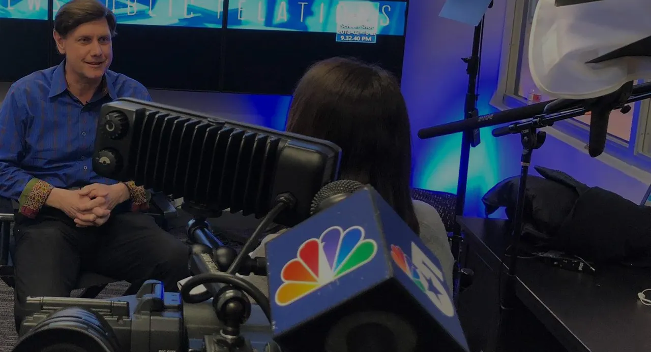 Jeff Crilley being interviewed by NBC 5 in a television studio